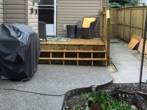 New Concrete Patio with a Wood Deck